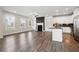 Spacious living room features a fireplace, lots of windows and hardwood floors at 787 Belrose Dr, Smyrna, GA 30080