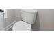 Bathroom with a standard white toilet and white walls and trim at 787 Belrose Dr, Smyrna, GA 30080