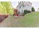 Large backyard with patio and deck; perfect for outdoor living and entertaining at 5093 Heartland Trl, Hoschton, GA 30548