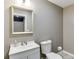 A clean and simple bathroom with gray walls and a white vanity at 5093 Heartland Trl, Hoschton, GA 30548