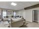 Comfortable living room with large sectional sofa and natural light at 5093 Heartland Trl, Hoschton, GA 30548