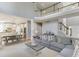 Open-concept living area with high ceilings, a fireplace, and seamless access to the kitchen at 5093 Heartland Trl, Hoschton, GA 30548