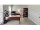 Well-lit home office features a large desk, dual monitors, and ample storage space at 5093 Heartland Trl, Hoschton, GA 30548