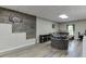 Finished basement with a basketball hoop and wood-look flooring at 5093 Heartland Trl, Hoschton, GA 30548