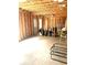 Spacious unfinished basement area featuring concrete floor and wood framing at 4346 Traipse Path, Ellenwood, GA 30294