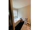 Bathroom featuring a soaking tub near a window and vanity storage at 4346 Traipse Path, Ellenwood, GA 30294
