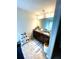 Bright bathroom with a double vanity, decorative mirror, and stylish light fixture at 4346 Traipse Path, Ellenwood, GA 30294