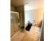 Spacious bathroom featuring a shower, soaking tub, and convenient storage options at 4346 Traipse Path, Ellenwood, GA 30294