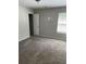 Bedroom with a window and neutral carpet and paint throughout at 4346 Traipse Path, Ellenwood, GA 30294