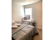 Bedroom with lighted vanity and neutral-colored walls and carpet at 4346 Traipse Path, Ellenwood, GA 30294