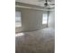 Bedroom with neutral carpet, two windows, and a ceiling fan at 4346 Traipse Path, Ellenwood, GA 30294