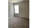 Bedroom with neutral carpet and paint and one window at 4346 Traipse Path, Ellenwood, GA 30294