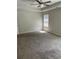 Bedroom with neutral carpet, one window, and a ceiling fan at 4346 Traipse Path, Ellenwood, GA 30294