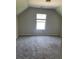 Bedroom with neutral carpet and paint and one window at 4346 Traipse Path, Ellenwood, GA 30294