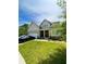 Traditional two-story home with a covered front porch and an attached two-car garage at 4346 Traipse Path, Ellenwood, GA 30294