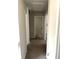 Hallway with carpet and neutral-colored walls and doors at 4346 Traipse Path, Ellenwood, GA 30294