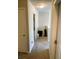 Hallway with neutral-colored walls and carpet at 4346 Traipse Path, Ellenwood, GA 30294