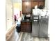 Efficient kitchen area boasts stainless steel appliances, ample cabinets, and wood-look flooring at 4346 Traipse Path, Ellenwood, GA 30294