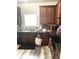 Well-lit kitchen features a window over the sink, granite counters, and dark wooden cabinets at 4346 Traipse Path, Ellenwood, GA 30294