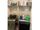 Well-equipped laundry room featuring modern washer and dryer with convenient overhead shelving at 4346 Traipse Path, Ellenwood, GA 30294
