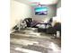 Inviting living room features wood-look flooring, cozy seating, and a ceiling fan for added comfort at 4346 Traipse Path, Ellenwood, GA 30294