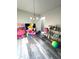 Room with gray wood-look flooring and modern furnishings and decor at 4346 Traipse Path, Ellenwood, GA 30294