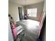 Room with gray wood-look flooring and natural light from a window at 4346 Traipse Path, Ellenwood, GA 30294