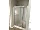 Shower with sliding glass door and chrome hardware at 4346 Traipse Path, Ellenwood, GA 30294
