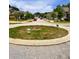 View of a residential street and street roundabout in a housing community at 4346 Traipse Path, Ellenwood, GA 30294