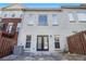 View of the home's backyard featuring a brick exterior and a fenced in yard area at 6023 Brookside Oak Cir, Norcross, GA 30093