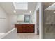 Bright bathroom featuring a double sink vanity with a granite countertop and a glass enclosed shower at 6023 Brookside Oak Cir, Norcross, GA 30093