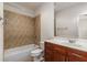 Functional bathroom featuring tiled shower, vanity with wood cabinets, and a toilet at 6023 Brookside Oak Cir, Norcross, GA 30093