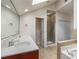 Bright bathroom featuring double sink vanity, walk-in shower, and tub with tile surround at 6023 Brookside Oak Cir, Norcross, GA 30093