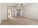 Spacious bedroom with neutral carpet and ceilings, plus a view of the upstairs hallway at 6023 Brookside Oak Cir, Norcross, GA 30093