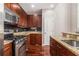 Well-equipped kitchen with stainless steel appliances, granite countertops, and ample cabinet space at 6023 Brookside Oak Cir, Norcross, GA 30093