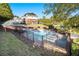 Community pool featuring lounge chairs and a fenced in enclosure at 6023 Brookside Oak Cir, Norcross, GA 30093