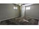 Neutral bedroom with updated carpet, windows for natural light, and a ceiling fan at 103 Rigby Ne St, Marietta, GA 30060