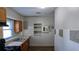 Compact kitchen space with a window, white tile walls, and modern gas range at 103 Rigby Ne St, Marietta, GA 30060