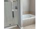 Well-lit bathroom featuring a shower and a soaking tub at 1536 Drew Nw Dr, Atlanta, GA 30318