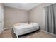 Neutral bedroom with a bed, carpet, and gray curtains at 1536 Drew Nw Dr, Atlanta, GA 30318