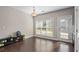 Bright dining area with hardwood floors, large window, and modern light fixture near the entry door at 1536 Drew Nw Dr, Atlanta, GA 30318