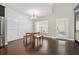 Bright dining area with modern light fixture, chair rail detail, and hardwood floors at 1536 Drew Nw Dr, Atlanta, GA 30318