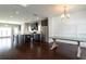 Open kitchen and dining area with stainless steel appliances, hardwood floors, and natural light at 1536 Drew Nw Dr, Atlanta, GA 30318