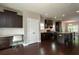 Modern kitchen with desk area, stainless steel appliances, granite countertops, and hardwood floors at 1536 Drew Nw Dr, Atlanta, GA 30318