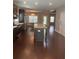 Open kitchen with granite counters, stainless appliances, kitchen island and dark wood cabinets at 1536 Drew Nw Dr, Atlanta, GA 30318
