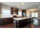 Spacious kitchen with granite countertops, dark cabinetry, stainless steel appliances, and hardwood floors at 1536 Drew Nw Dr, Atlanta, GA 30318