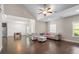 Cozy living room with vaulted ceiling, modern furniture, lots of windows, and hardwood floors at 1536 Drew Nw Dr, Atlanta, GA 30318