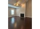 Spacious living room with vaulted ceilings, fireplace, and dark hardwood floors at 1536 Drew Nw Dr, Atlanta, GA 30318