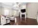 Open living room with fireplace, vaulted ceiling, hardwood floors, and lots of natural light at 1536 Drew Nw Dr, Atlanta, GA 30318