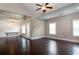 Open living space with hardwood floors seamlessly connecting the kitchen, dining area, and living room at 1536 Drew Nw Dr, Atlanta, GA 30318